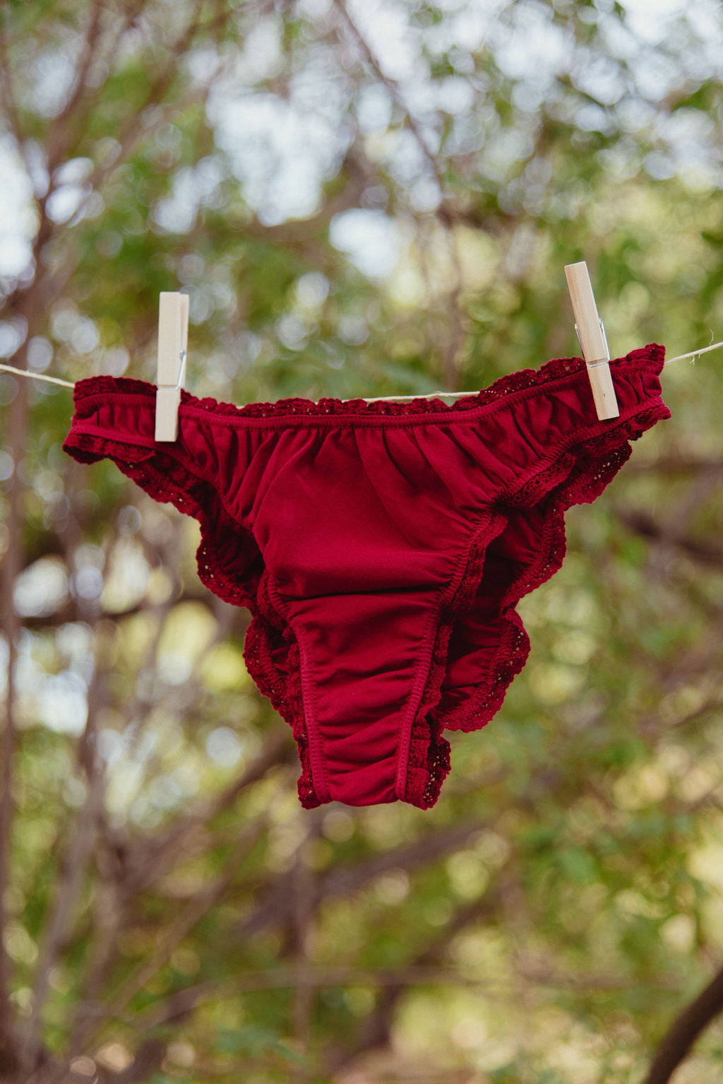 Paulette & Maria Burgundy organic cotton panties, outdoor nature lifestyle view.