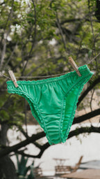 Paulette & Maria Neptune Green organic cotton panties, clothesline outdoor lifestyle view.