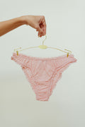 Paulette & Maria Powder Pink organic cotton frilly panties, front view on a white background.