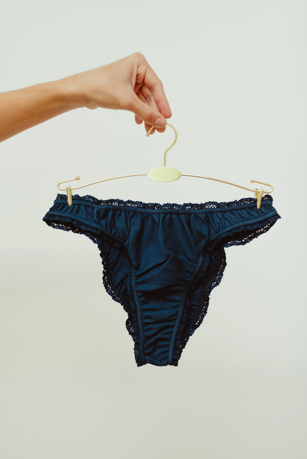 Paulette & Maria Sailor Blue organic pima cotton frilly panties, lace trim detail on a white background.