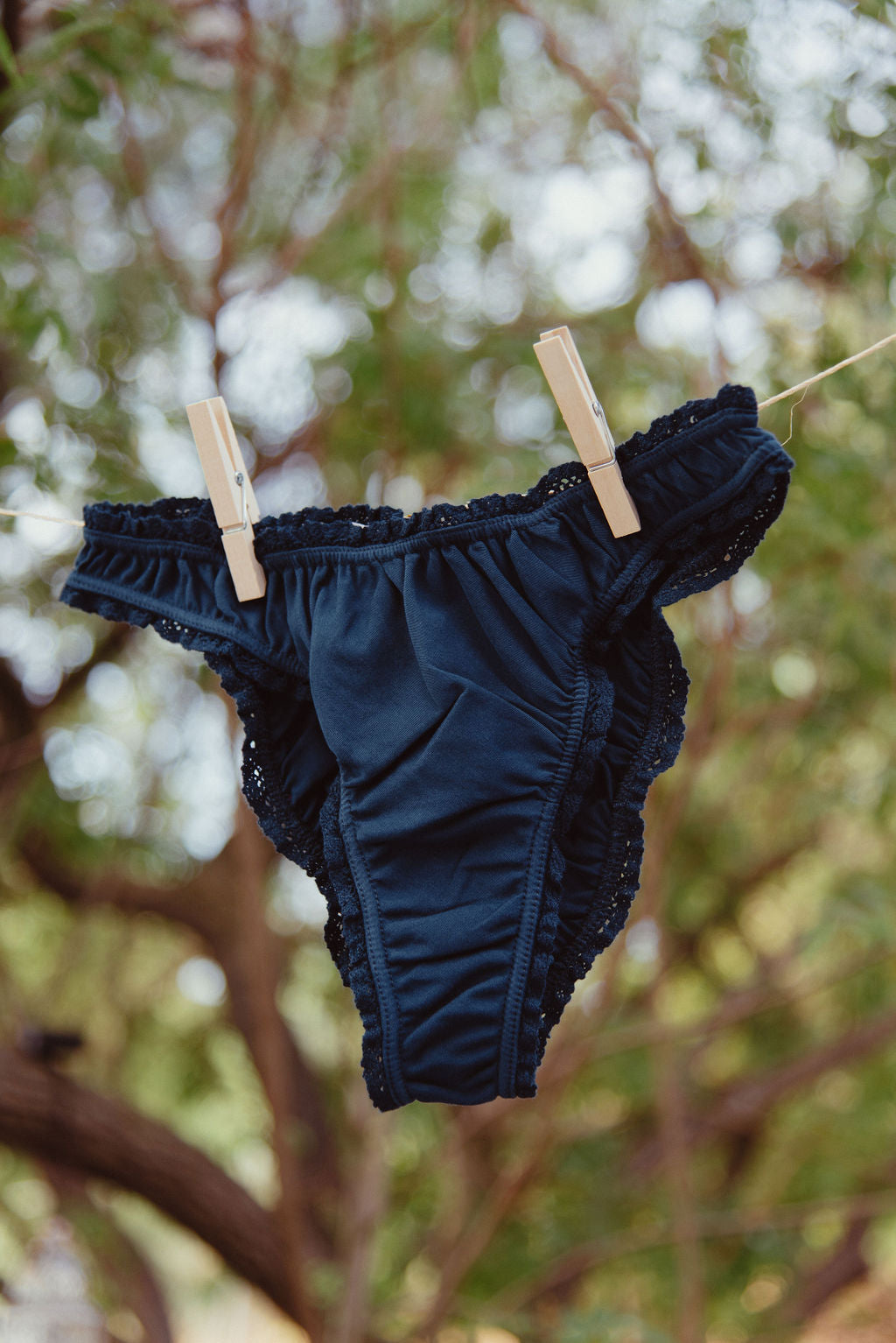 Paulette & Maria Sailor Blue frilly panties, product flat lay on a white background.