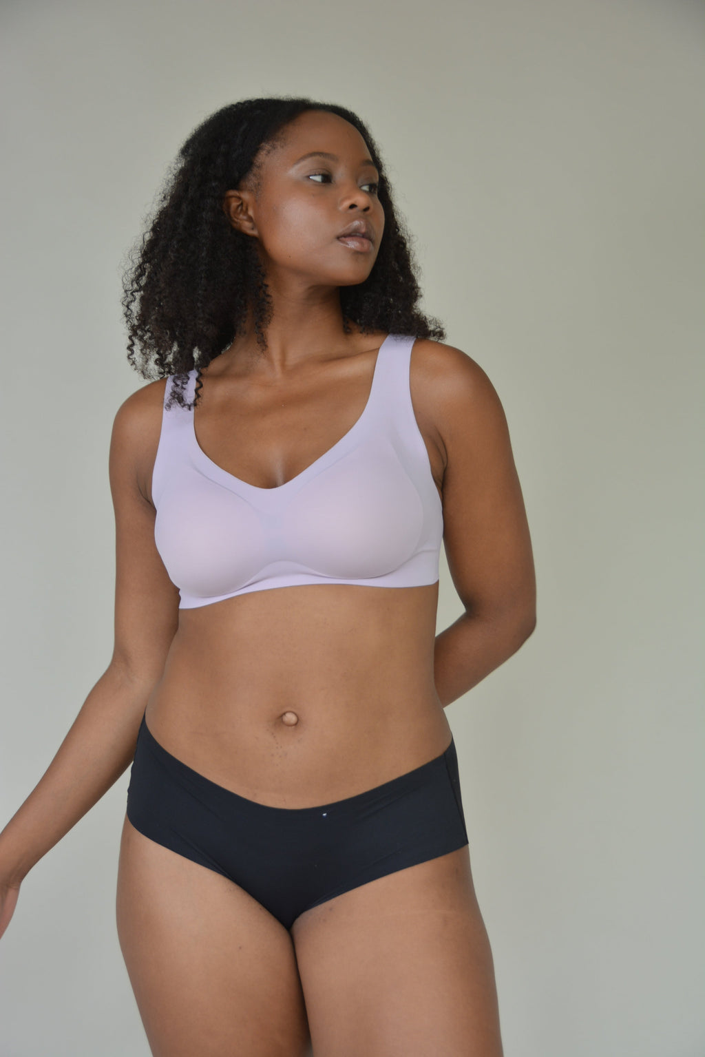 The Only Bra V-Neck Lift Bra worn on model with straight neck, lifestyle view.