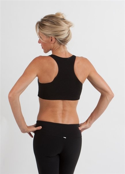 Spun Bamboo Women's Padded Sports Bra in Black, worn on model, back view on a white background.