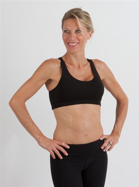Spun Bamboo Women's Padded Sports Bra in Black, worn on model, side view on a white background.